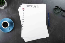 A sheet of paper with a list of 10 blank checks